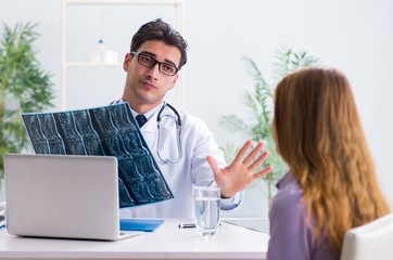 Doctor examining x-ray images of patient