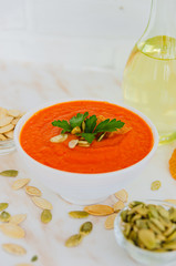 Appetizing orange pumpkin cream soup. Lunch for Halloween.