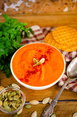 Appetizing orange pumpkin cream soup. Lunch for Halloween.
