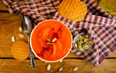 Appetizing orange pumpkin cream soup. Lunch for Halloween.