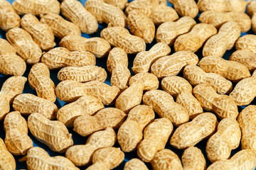 Ripe inshell peanuts. Peanut pattern. Healthy eating concept.