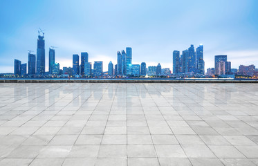 Panoramic skyline and buildings with empty concrete square floor,qingdao,china