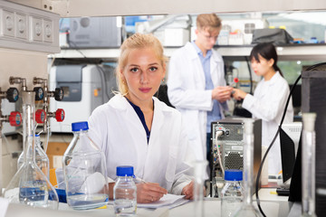 Female scientist registering results of research