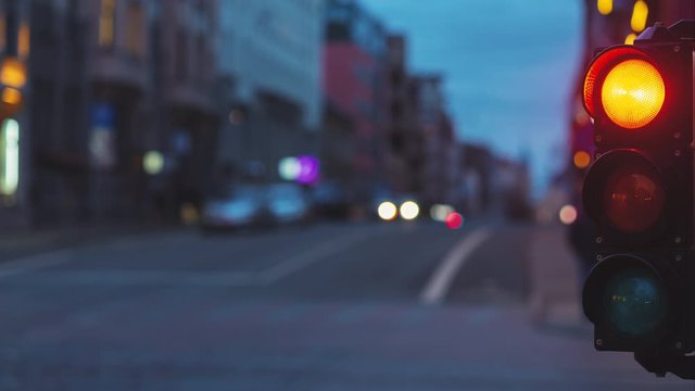 Timelapse of a traffic light at the crossroads of Lacplesa and Baron streets on a fall weekend evening in Riga