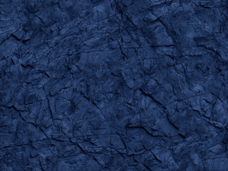 Abstract blue rock texture. Black rock background. Dark blue stone grunge background. Toned blue stone texture.