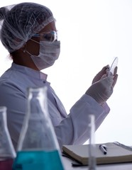 Female scientist researcher conducting an experiment in a labora