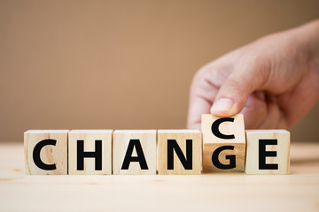 Hand flipping wooden cubes for change wording between 