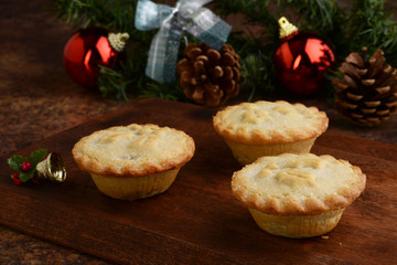 closeup mincemeat pies with christmas ornaments