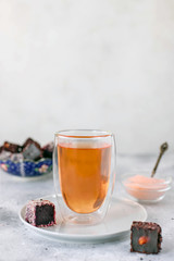 traditional turkish tea with turkish sweets. light gray background, close-up