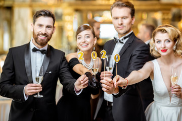 People celebrating New Year holiday indoors