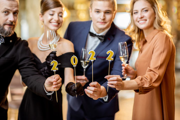 People celebrating New Year holiday indoors