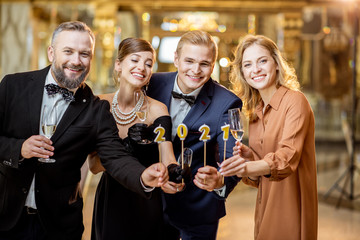 People celebrating New Year holiday indoors