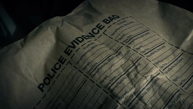 Police Evidence Bag On Table Closeup