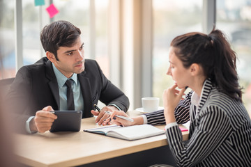 Business team working in office with tablet and documents on desk with copy space using as background professional team, successful business coworker consultant concept.