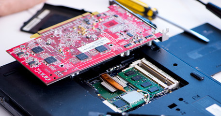 Repairman working in technical support fixing computer laptop tr