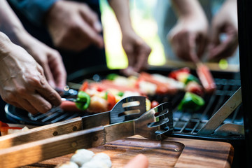 BBQ grilled party in park by man hand