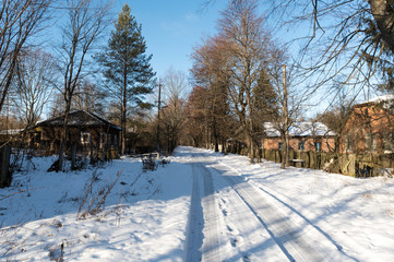 The road leading to the village. Check in to the village. Winter in the village.