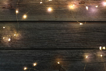 Christmas light on wood background,