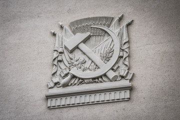 Sovet emblem on a historic building.