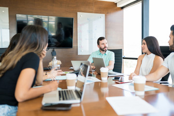 Coworkers Planning In Discussion At Office