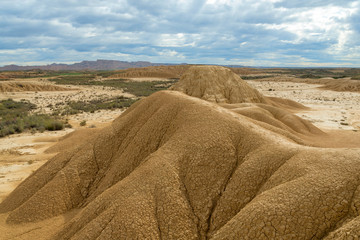 Sedimentary eroded mountains in the middle of the Spanish desert Bardenas Reales