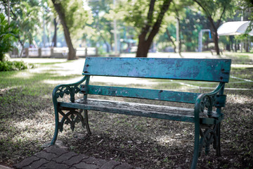 chair on green grass of city park
