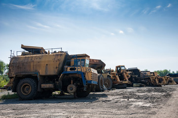 remains of old quarry trucks and machinery on junk yard