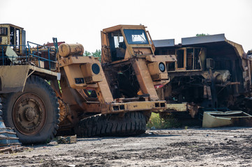 remains of old quarry trucks and machinery on junk yard