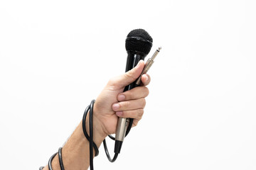 Hand holding a microphone isolated on white background