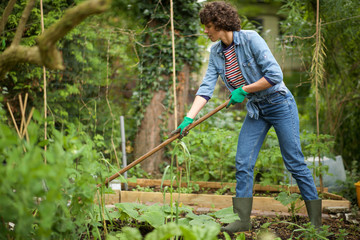 woman raking garden