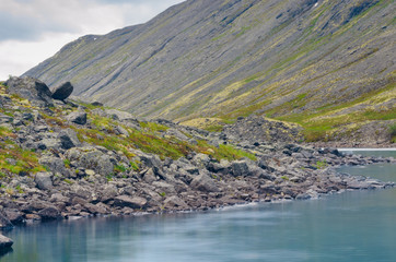 Fototapeta na wymiar Mountains with reflection in the lake. Hibiny mountains, Arctic circle, Kola peninsula, Murmansk region, Russia
