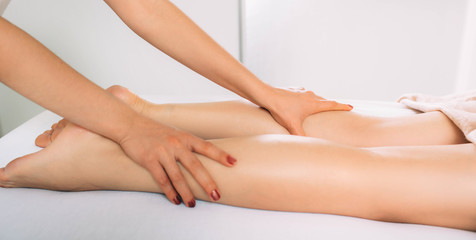 Obraz na płótnie Canvas anti cellulite leg and foot massage. massage for slim leg and body