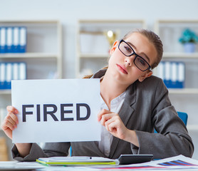 Businesswoman sitting in office with message