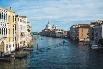 View of Canal Grande, boats and ships on the water with passengers.