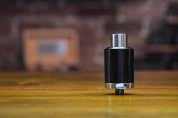 Electronic cigarette on a background of vape shop. E-cigarette for vaping.