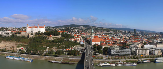 Panorama of Bratislava city, Slovakia. Bratislava castle and St. Martin Cathedral, river Danube