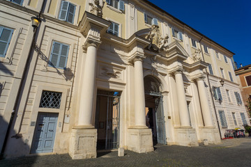 Fototapeta na wymiar entrance to the courtyard of Santa Cecilia's Church in Trastevere Rome Italy