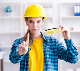 Woman in workshop with protective goggles