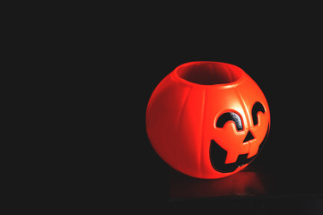 Halloween pumpkin head with golden light in dark night bakckground. Halloween holiday concept.
