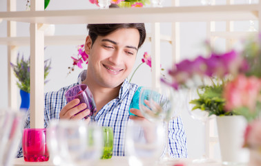 Young handsome man shopping in shop