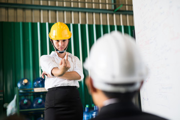 Angry woman worker show middle finger to boss