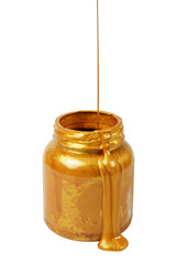 Pouring golden paint on the can