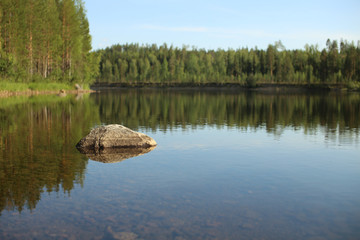 Fototapeta na wymiar The stream Skelleftealven in Vasterbotten, Northern Sweden