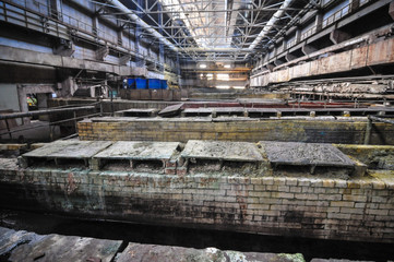 Fototapeta premium Baths and cans of chemically active liquid in hazardous industries
