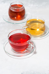 assortment of tea in glass cups, vertical top view