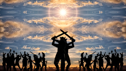 Giant silhouettes of two Gods-Vikings (vintage toy soldiers) with swords standing back to back among armed groups of Valhalla warriors, sunset clouds, sun, Old Norse, Odin and Asgard themes - obrazy, fototapety, plakaty