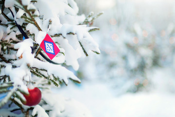 Arkansas flag. Christmas tree branch with a flag of Arkansas state. Xmas holidays greetings card....