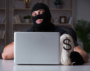 Hacker hacking computer late at night