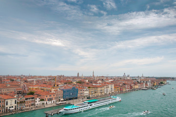 Fototapeta na wymiar Aerial view of Giudecca Channel with big boat, Venice Italy. Concept: historic Italian places, evocative and little-known views of Venice