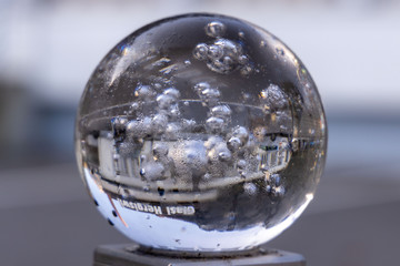 Glassball in front of a factory